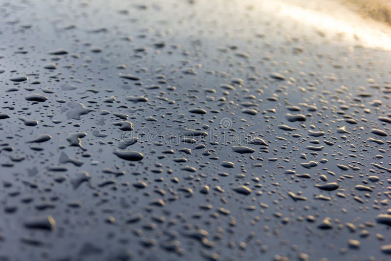 Water drops on black, abstract background stock photo