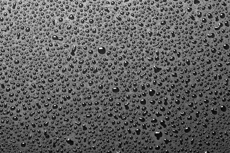 Water drops on black background stock images