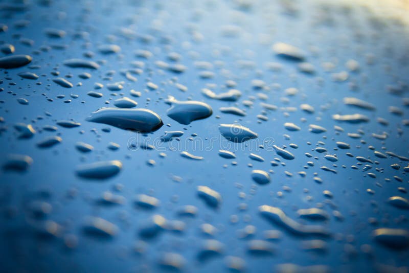 Water drops on blue, abstract background stock images