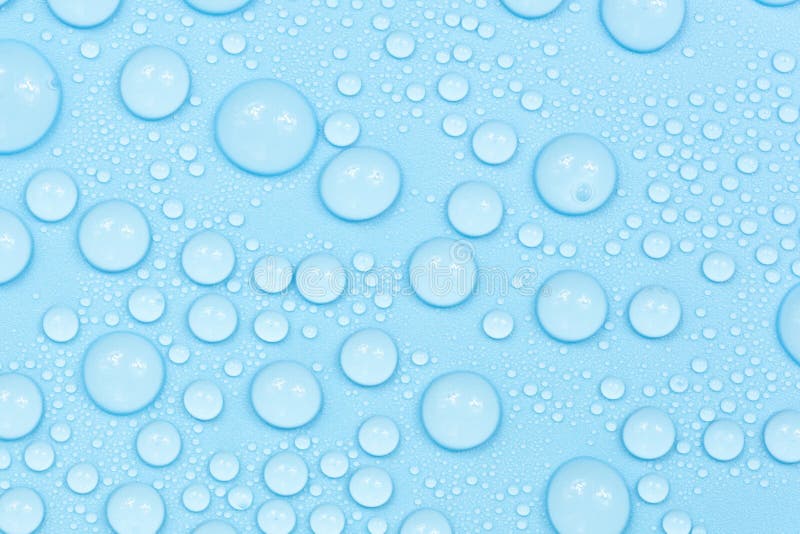 Water drops on blue background texture. Backdrop glass covered with drops of water. bubbles in water