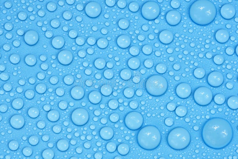 Water drops on blue background texture. Backdrop glass covered with drops of water. bubbles in water