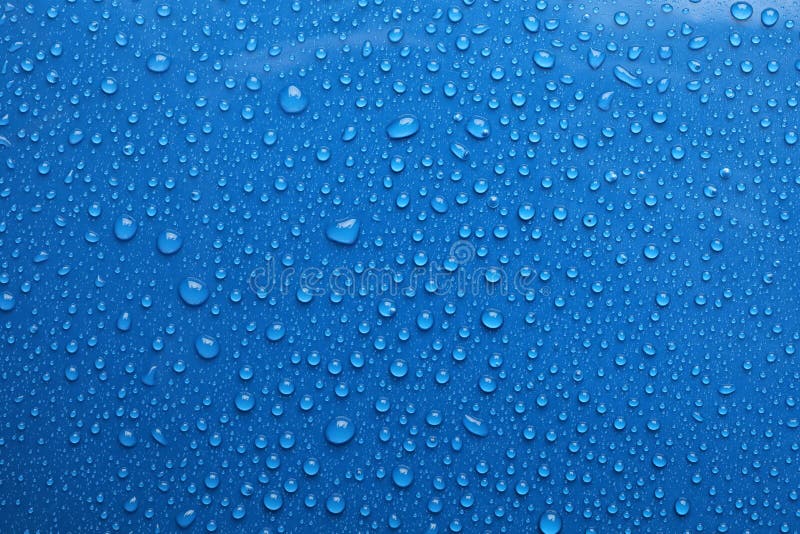 Water drops on blue background royalty free stock photo