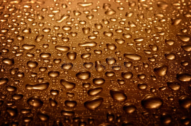 Water drops on glass, brown color