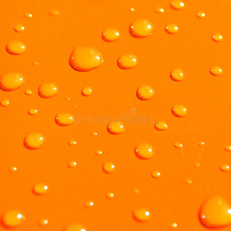 Water drops on orange metal ba