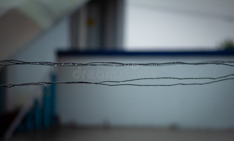 Water drops over the metal wires used for drying clothes royalty free stock photos Water drops over the metal wires used for drying clothes royalty free stock photos