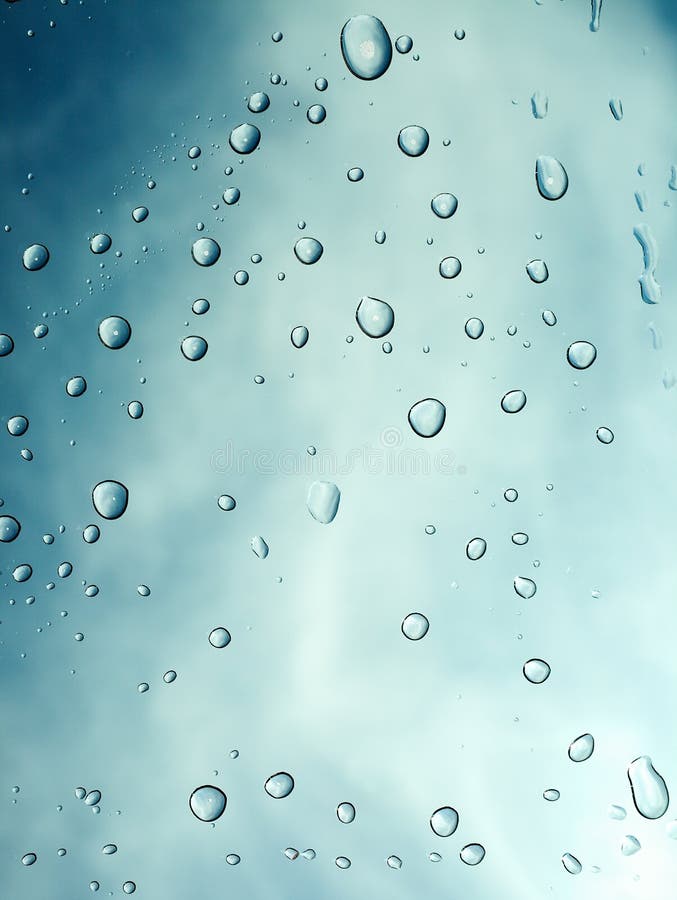 Water drops with sky and clouds background