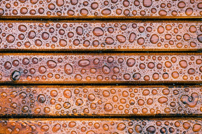 Water drops on wooden garden table