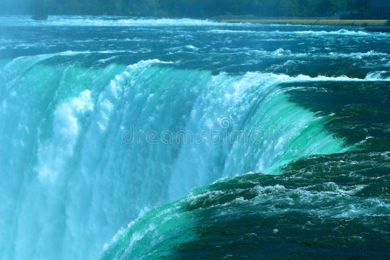 Water falls rises over the edge of the Horseshoe Falls at Niagara