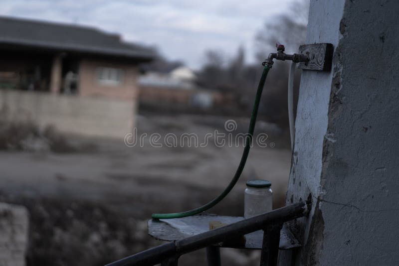 Water Faucet With A Hose Connected To A Metal Screed Stock Image