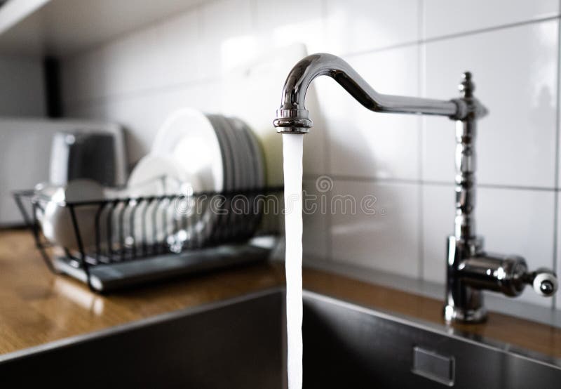 Dish Rack Holds Many Dishes And Cups Against Wooden Countertop White Wall  Tiles Sink And Faucet Budget And Lightweight Antimicrobial Dish Drainer  With Drain Board At Modern Scandinavian Kitchen Stock Photo 