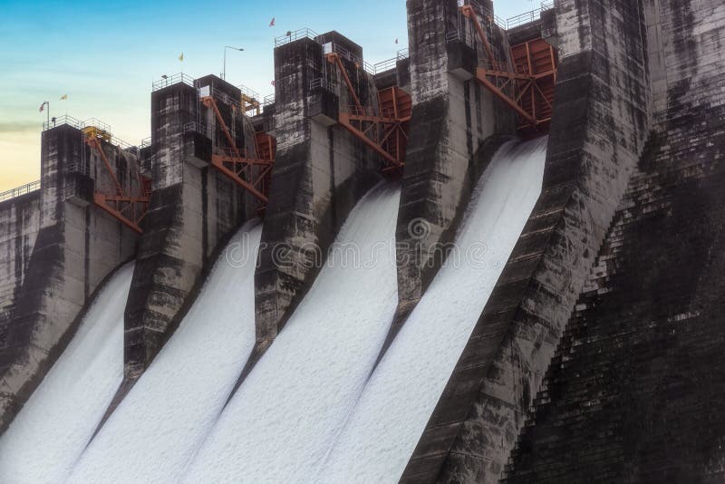 Water flowing over floodgates of a dam at Khun Dan Prakan Chon, Nakhon Nayok Province, Thailand.