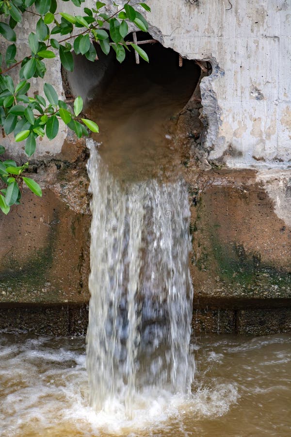 Water flows from a large hole in the wall stock photos Water flows from a large hole in the wall stock photos