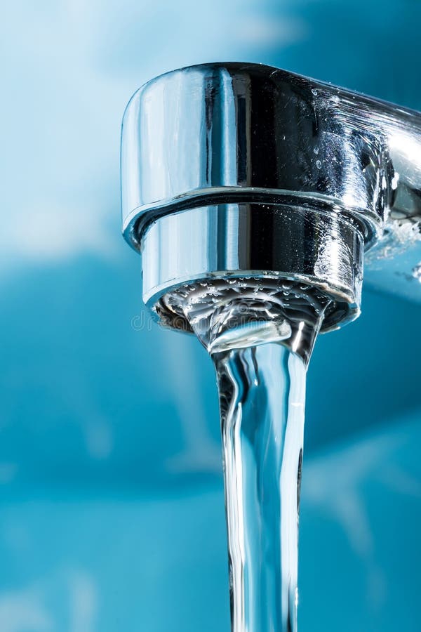Water Flows from a Modern Chromed Water Tap Faucet Macro Closeup Stock