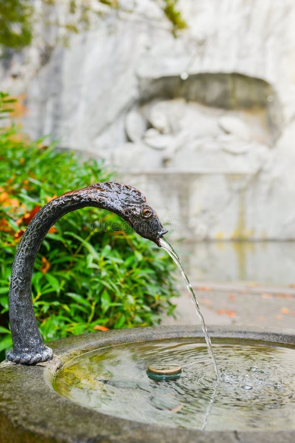 Water fountain near memorial of dying lion in Lucerne, Switzerland