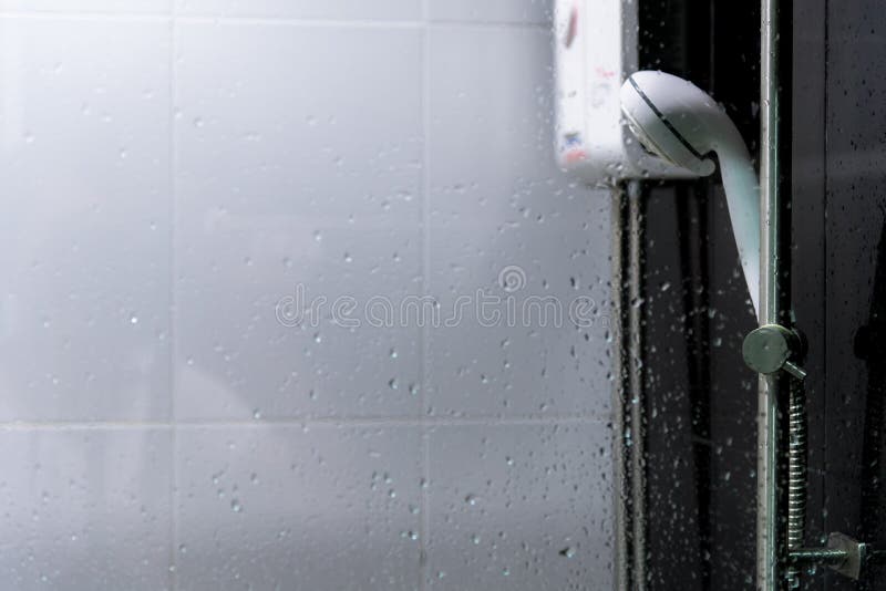 Water Heater and Shower Spray in Bathroom. Stock Photo Image of