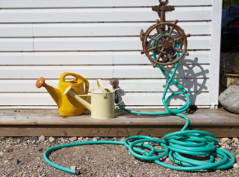 Water Hose and Watering Cans Stock Photo Image of anchor, wood 41370250