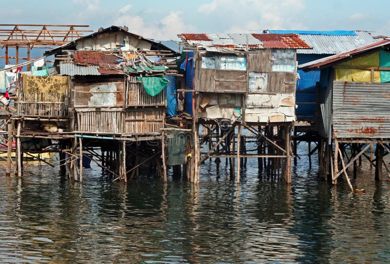 Slum Homes Built On Stilts Over Water. Slum Homes Built On Stilts Over Water