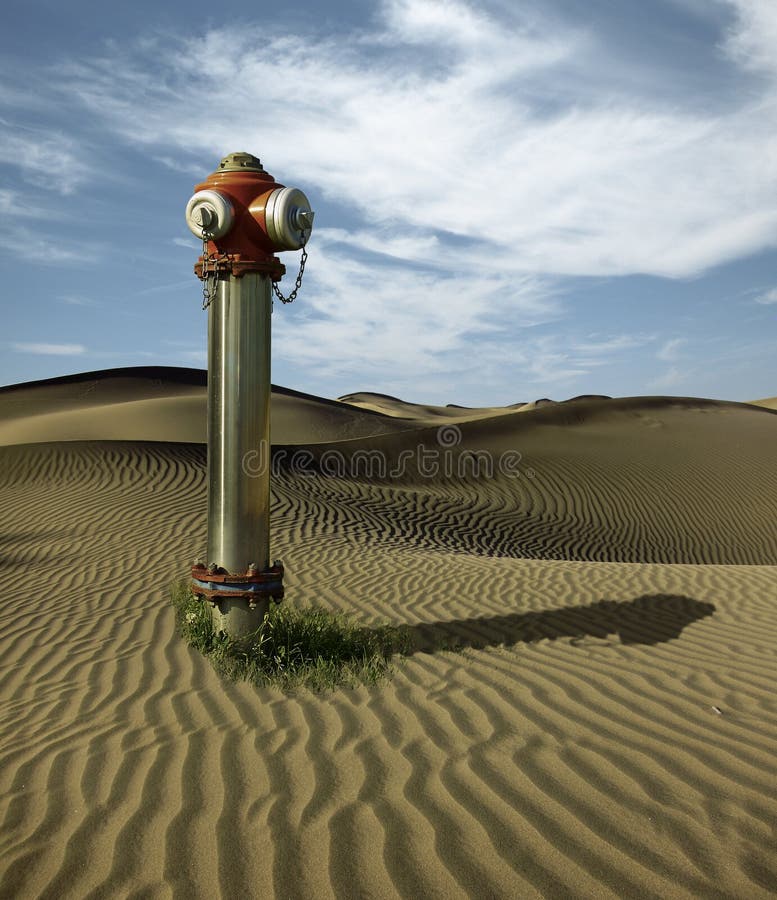 Water hydrant in the sand dunes royalty free stock photography