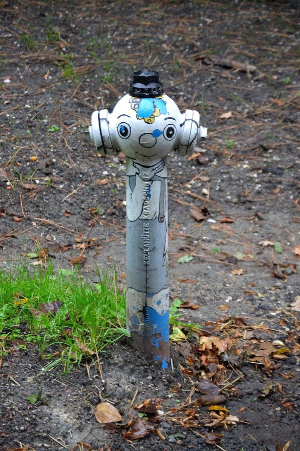 Water hydrant transformed into a fairy tale character by drawing stock photos