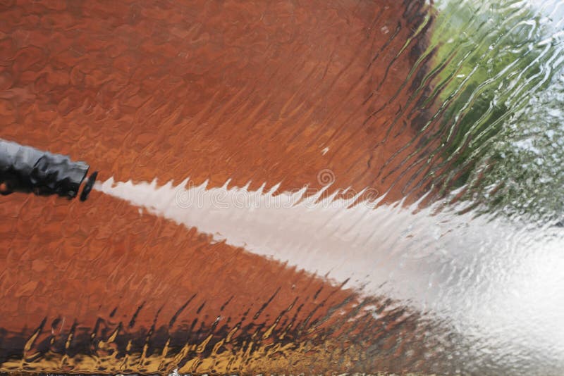 Water Jet from the Hand Wash Directed To the Side Window in the Machine