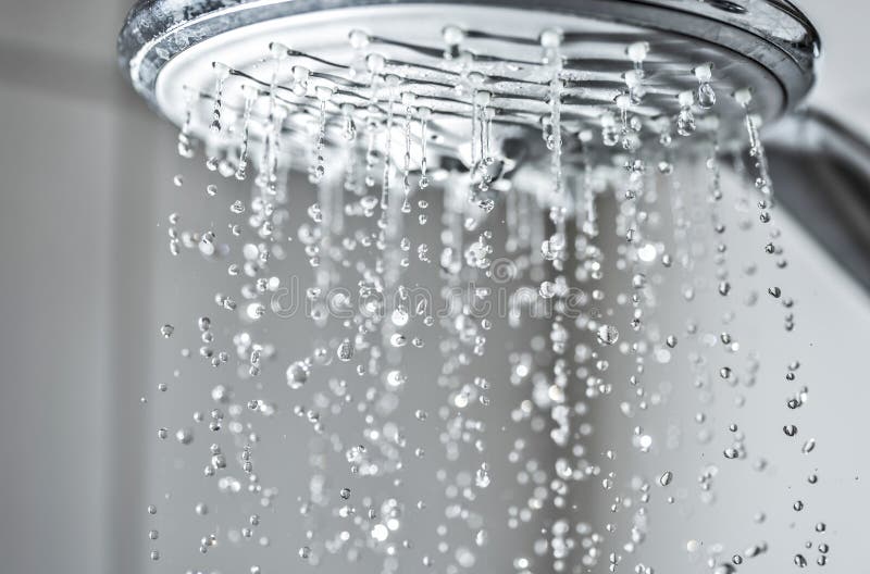Water jet from a shower head stock images