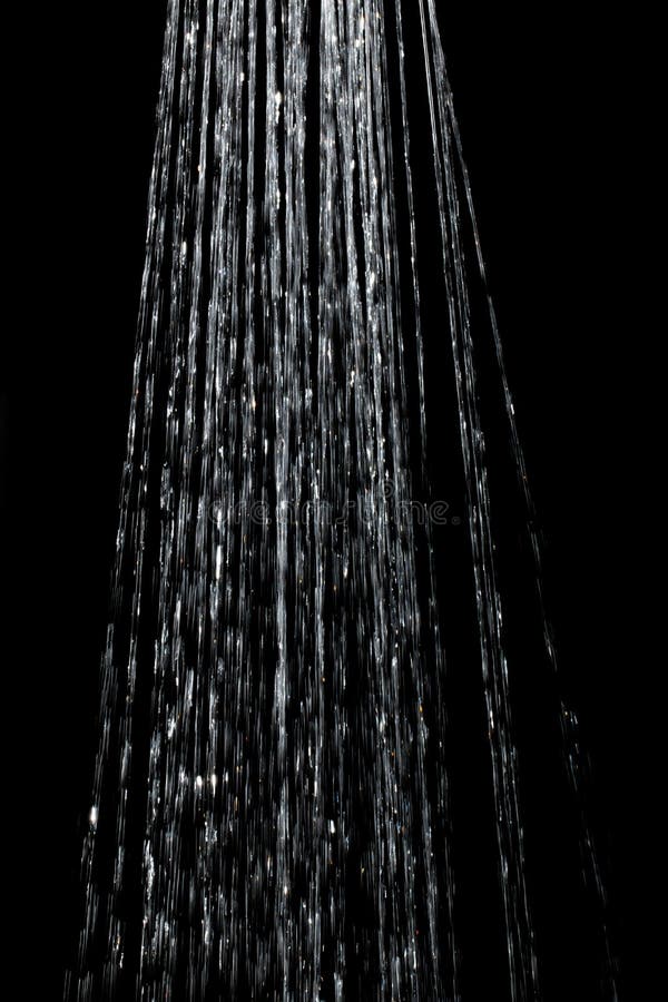 Water Jet with Spray on a Black Background Stock Image - Image of