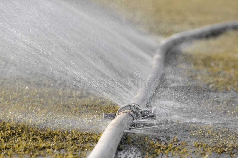 Water leaking from hole in a hose royalty free stock photos Water leaking from hole in a hose royalty free stock photos
