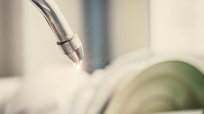 Water leaking from tap after clean dish , think for water saving royalty free stock photos