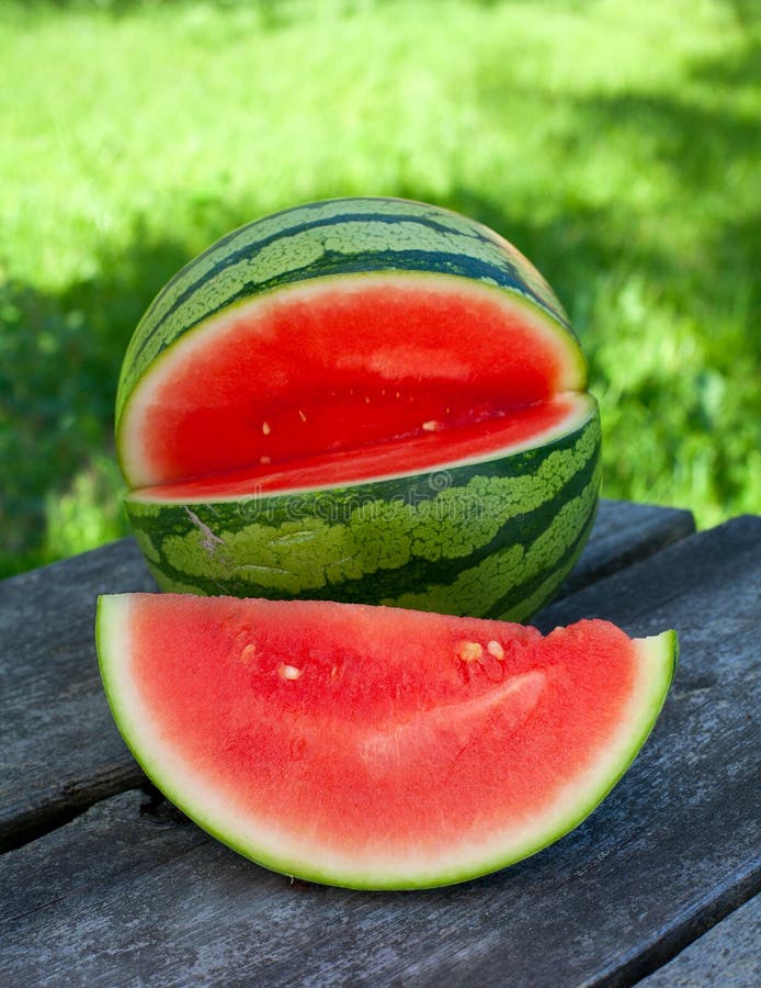 Water melon on wooden garden table