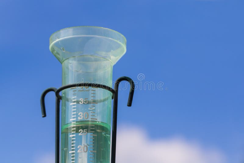 Water meter with rainwater and blue sky