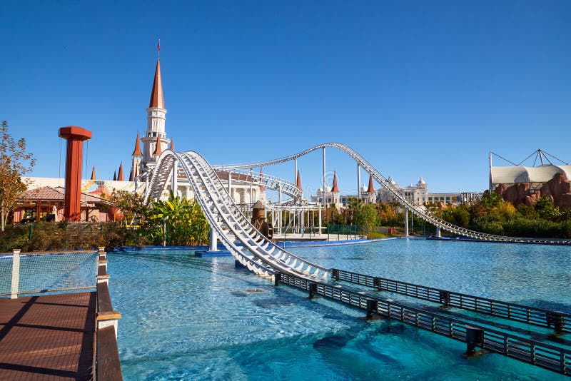 Water Park with pool and high roller coaster ride with rails in Land of legends