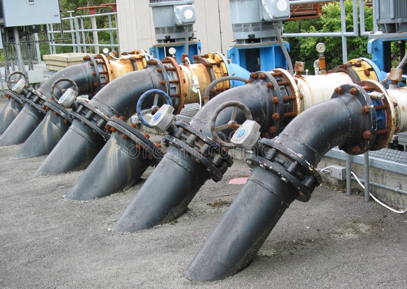 A row of water pipes at a fish hatchery supply water. A row of water pipes at a fish hatchery supply water.