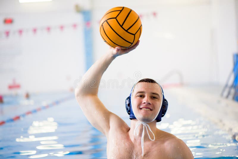 Water Polo Training. Young Sportsman Plays Water Polo in the Pool