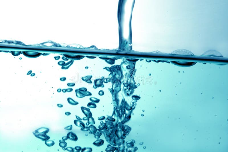 Water pouring down in gold stock image. Image of effect 40854935