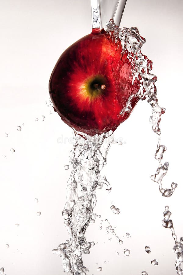 Water pouring off red apple.