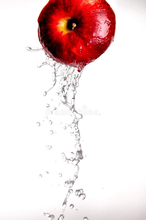 Water pouring off red apple.
