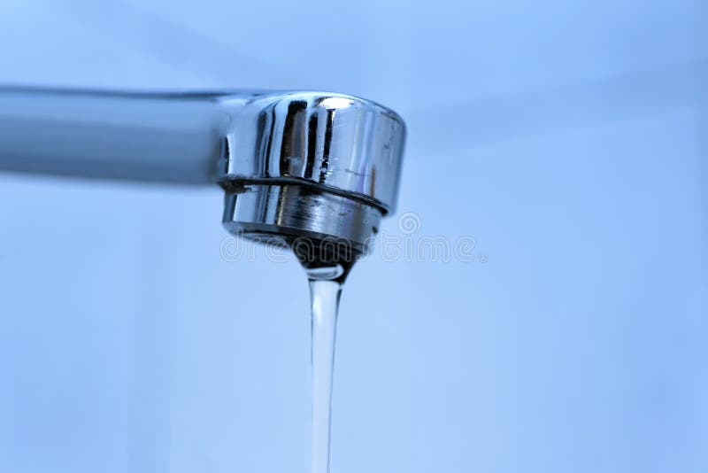 Water Pouring from Tap, Closeup. Water Saving Concept Stock Photo
