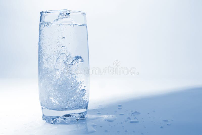 water pouring in transparent glass with bubbles of air