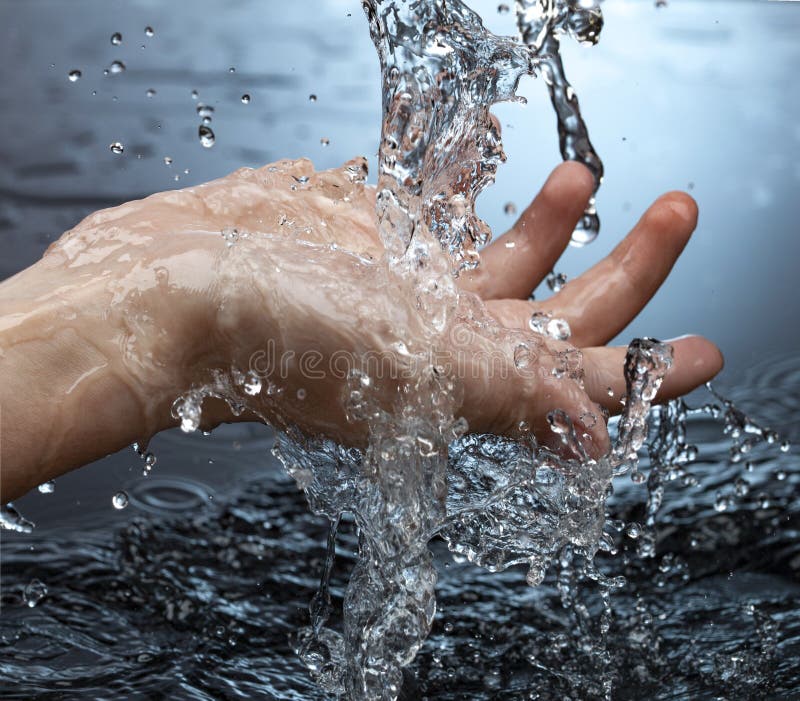 Water Pouring in Woman Hand on Blue Background Stock Image Image of