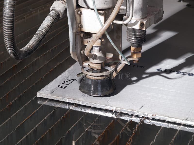 Water Pressure Cutting through Stainless Steel Materials Stock Image
