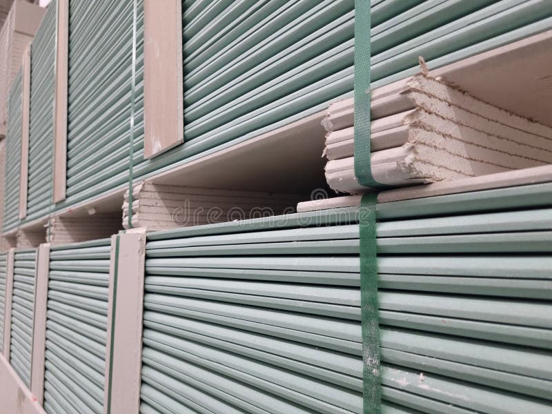 Water resistant plasterboard sheets stacked in a hardware store. royalty free stock image