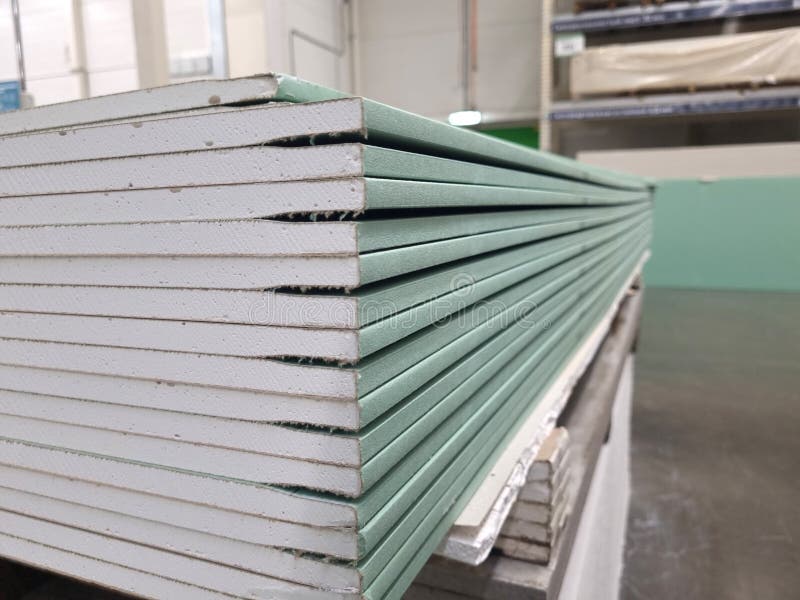Water resistant plasterboard sheets stacked in a hardware store. royalty free stock photos