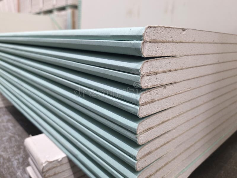 Water resistant plasterboard sheets stacked in a hardware store. stock photos