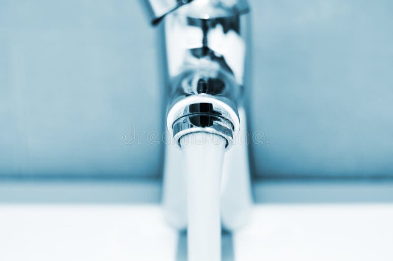 Water Running from a Faucet Stock Photo Image of horizontal, metallic