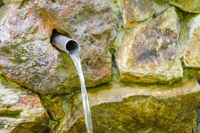 Water running from outdoor wall faucet