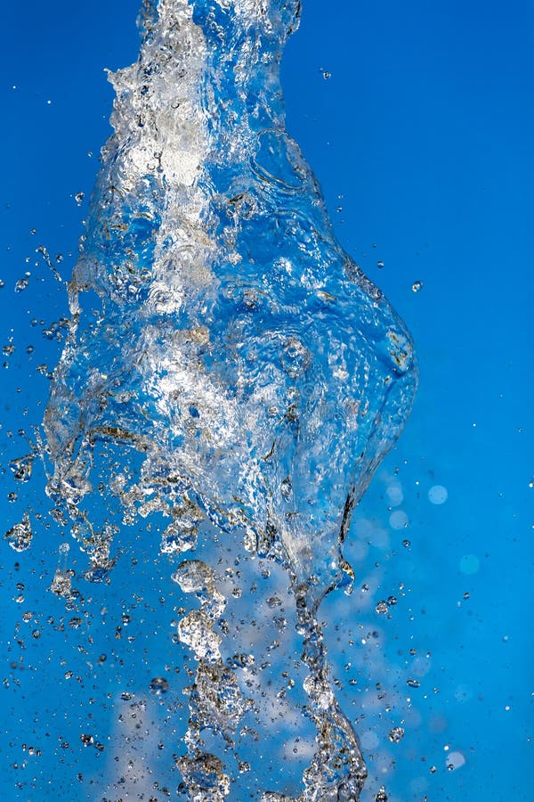 The Water Splash on Blue Background. Stock Photo Image of splash