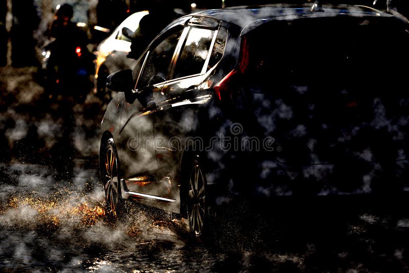 Water Splash with Car on Flooded Road after Rains Stock Photo Image