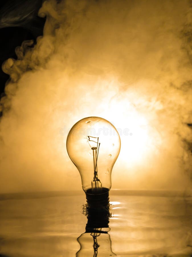 Water Splash on Dark Foggy Background. Abstract Concept. Light Bulb