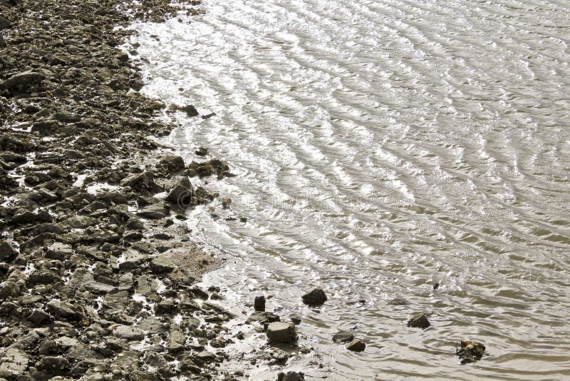 Water, stones, dike and rocks on the north German coast