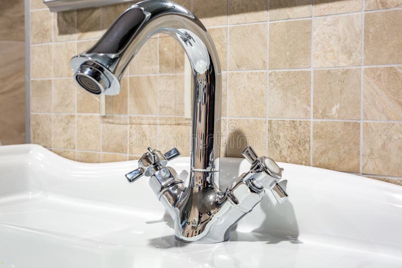 Water Tap Sink with Faucet in Expensive Loft Bathroom Stock Image